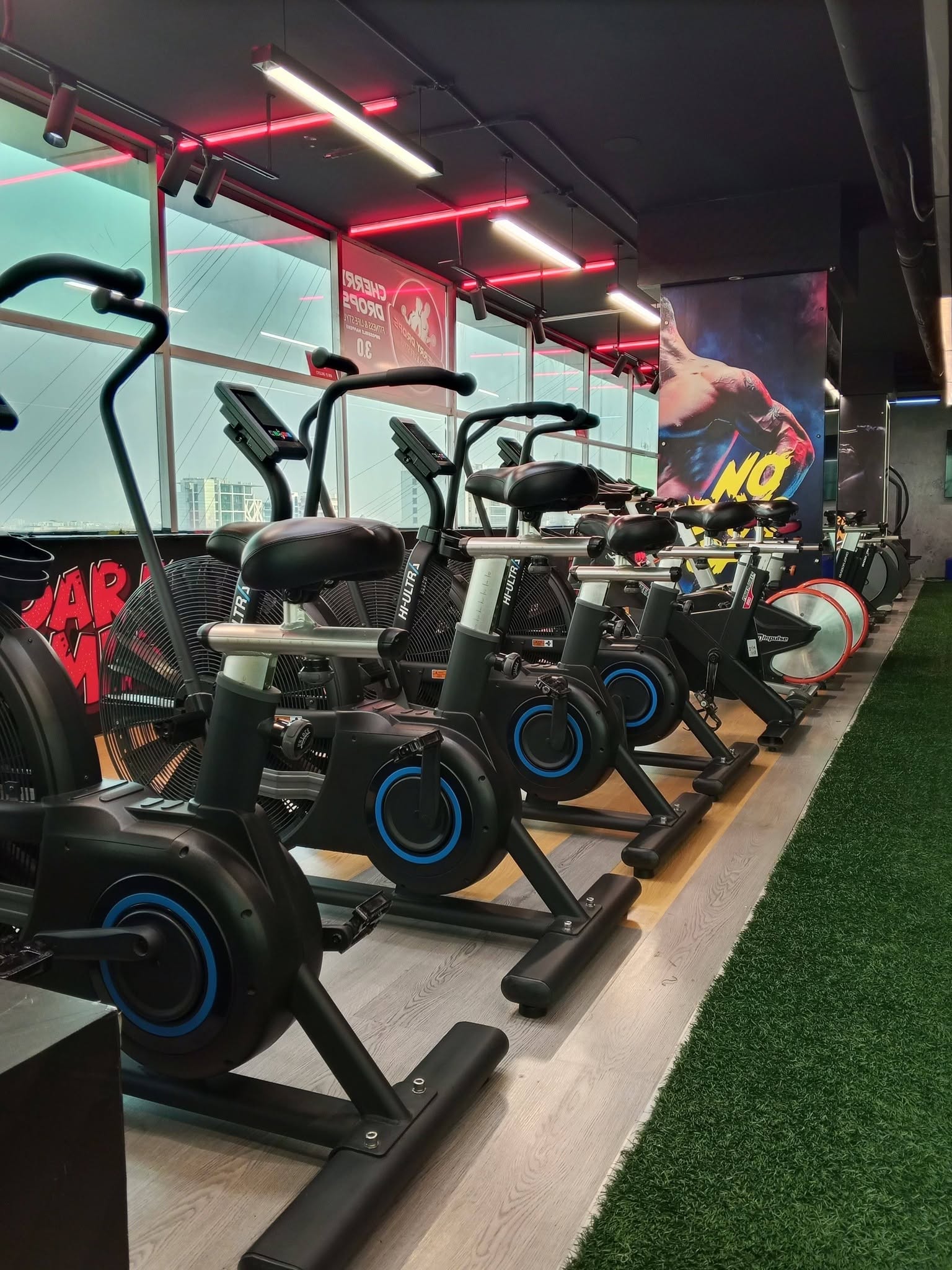 Machine row beside the mirrored training wall