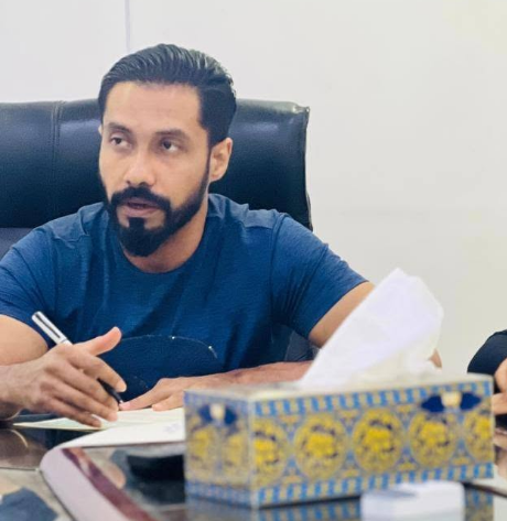Daud, founder of Cherry Drops Fitness & Life Style 3.0, at the office desk